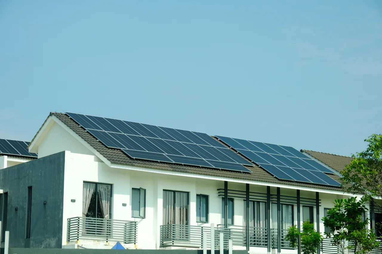 Eco-Friendly Miami Home with Rooftop Solar Panels Contributing to Green Real Estate Market